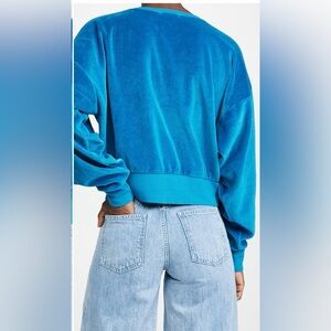 Suzie Kondi front pleat velour sweatshirt in Aegean blue.